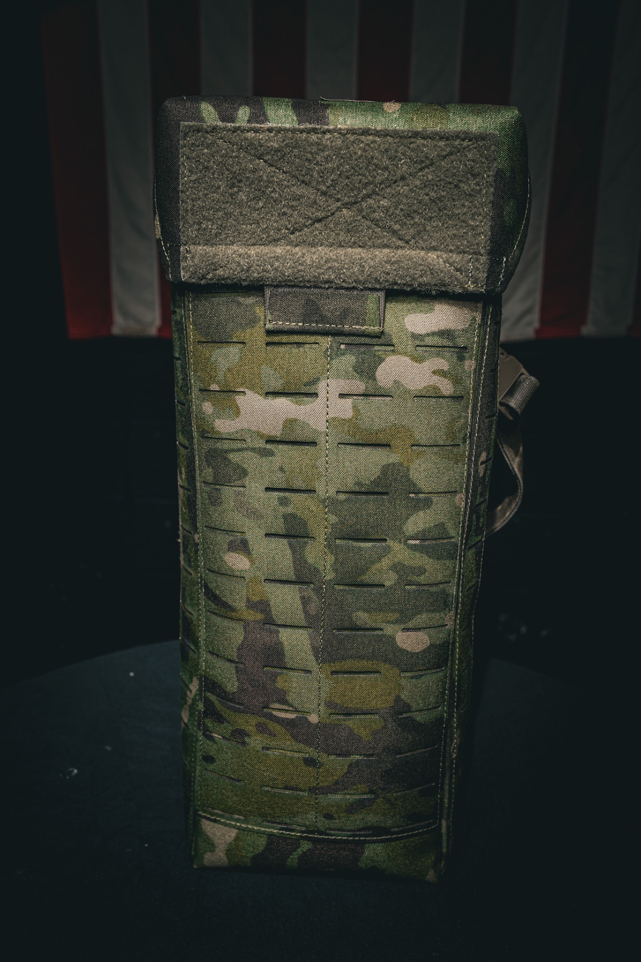 Side profile showing laser-cut MOLLE webbing